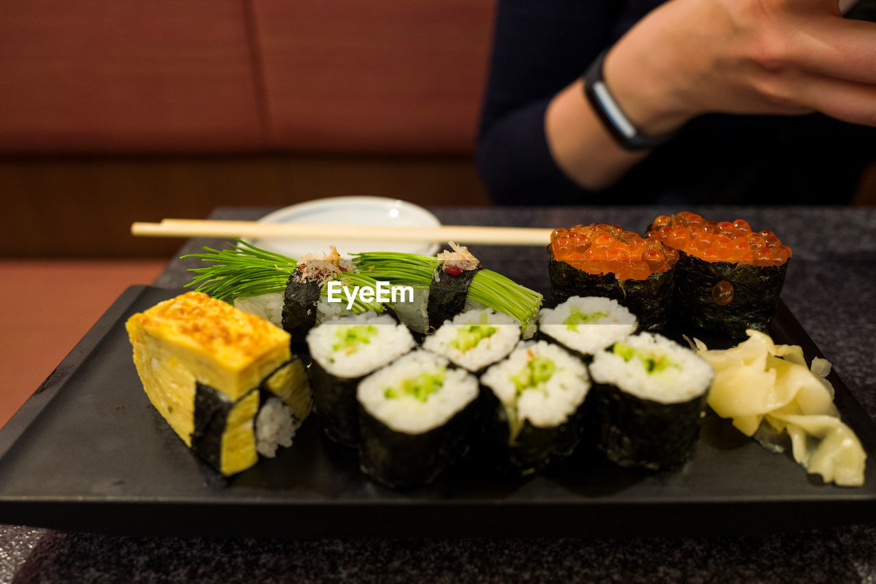 High angle view of sushi served in tray on table