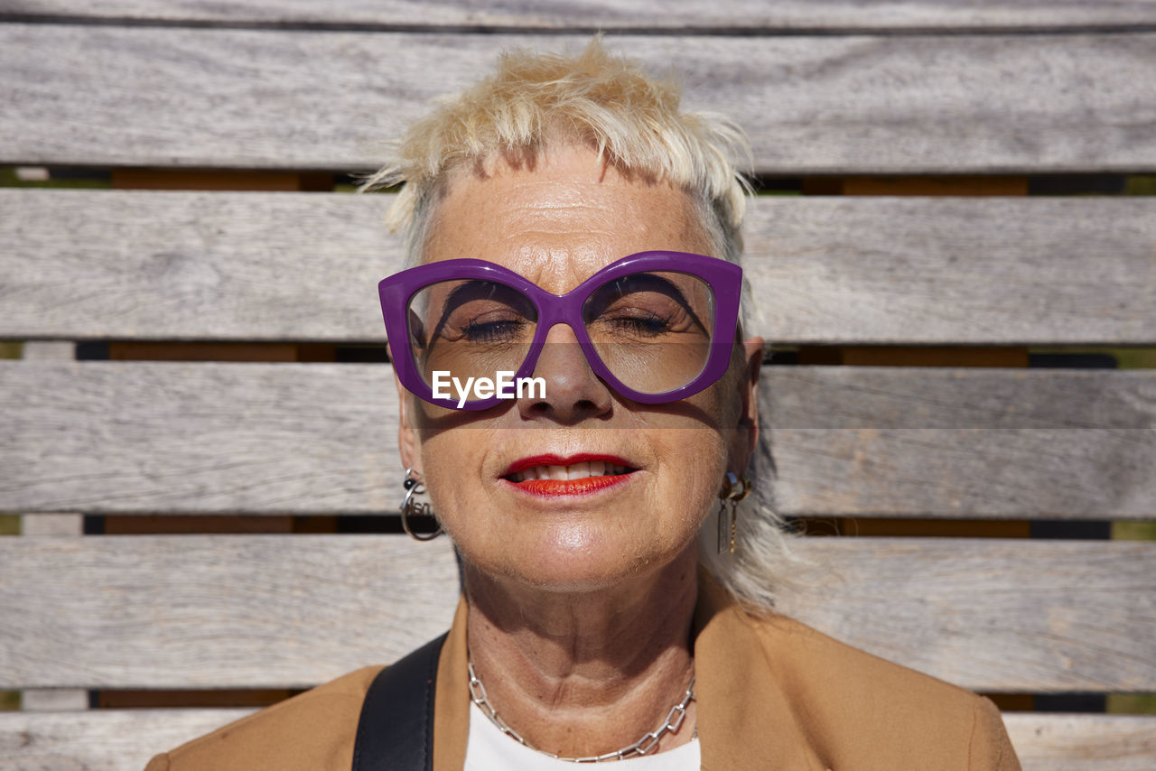 Woman sunbathing with eyes closed