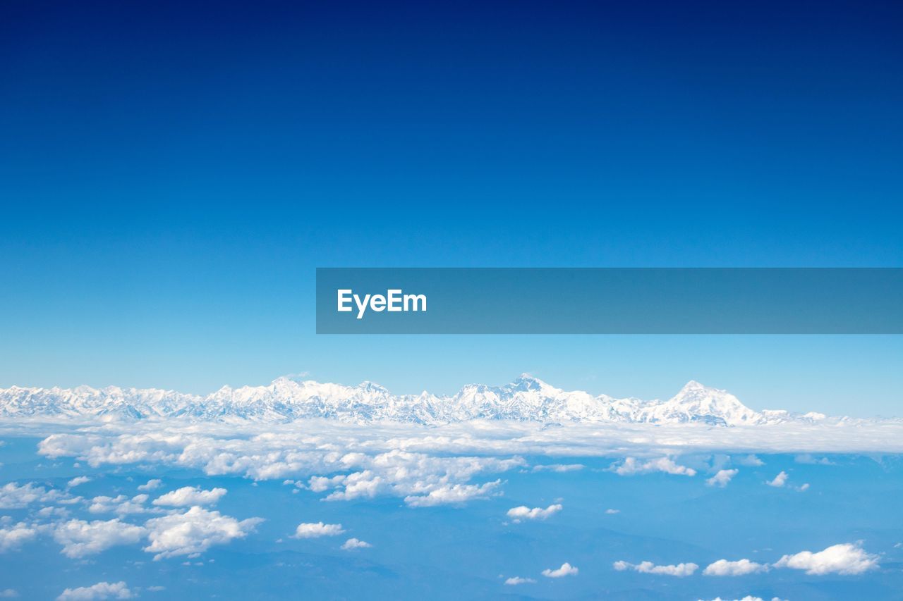 LOW ANGLE VIEW OF CLOUDS OVER BLUE SKY