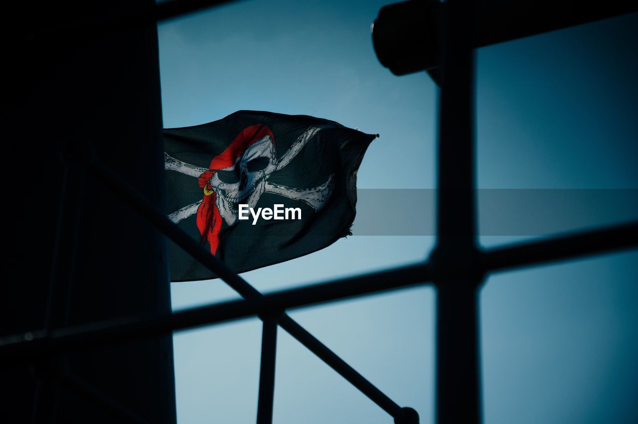 Low angle view of flag against sky