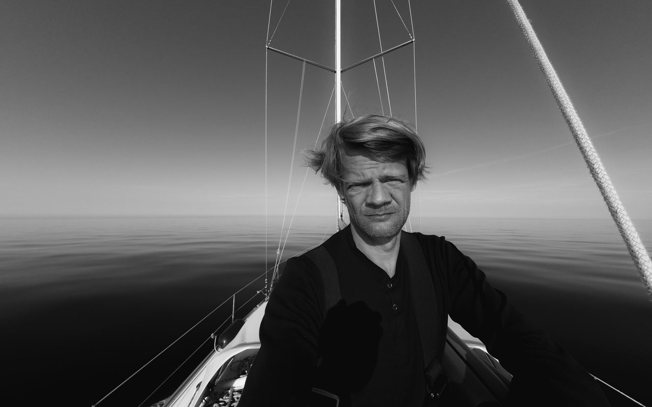 Portrait of men  standing against sea