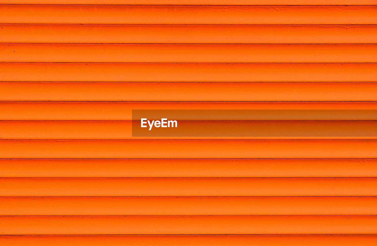 FULL FRAME SHOT OF ORANGE TEXTURED