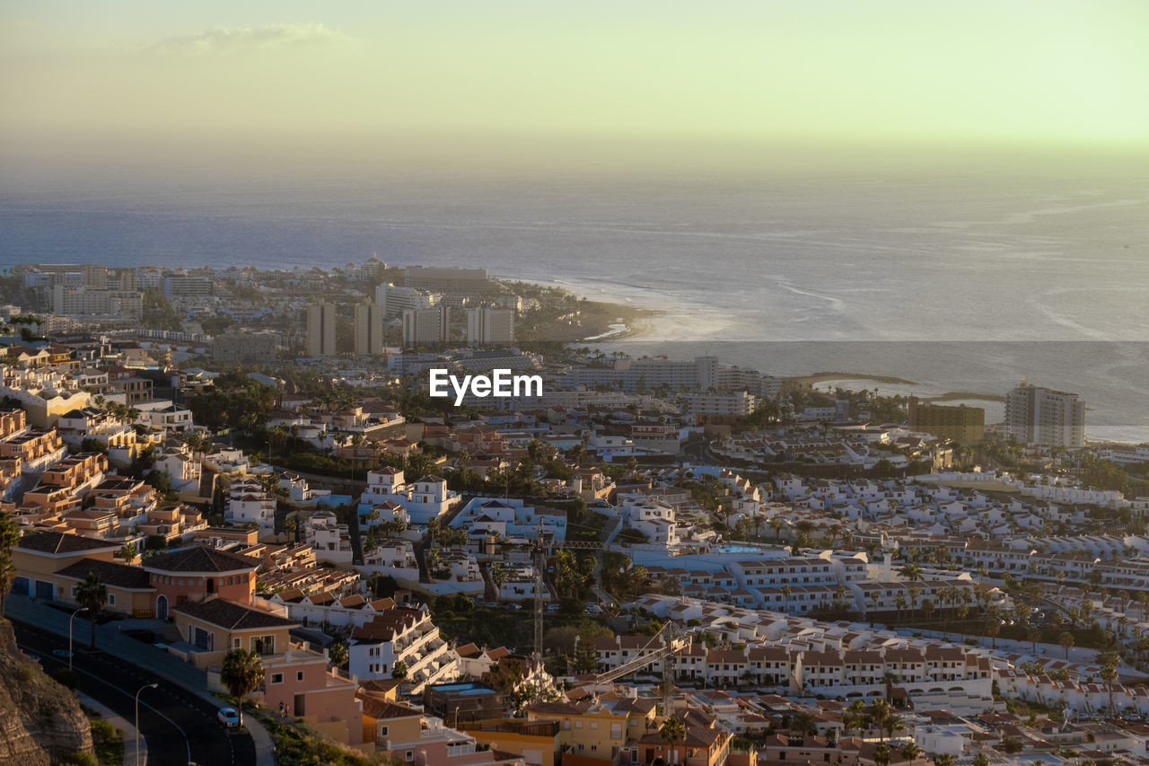 High angle view of city buildings against sky