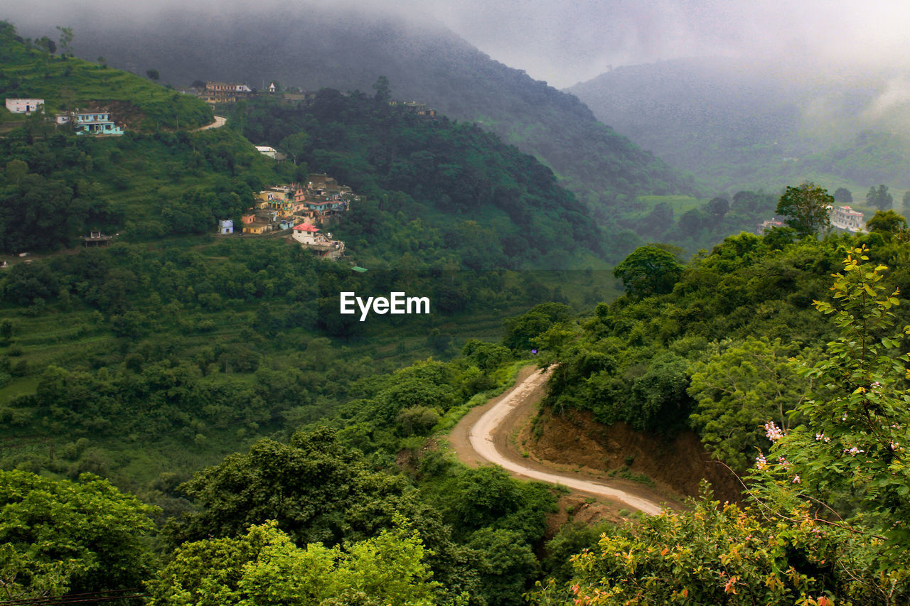 High angle view of mountain road amidst trees