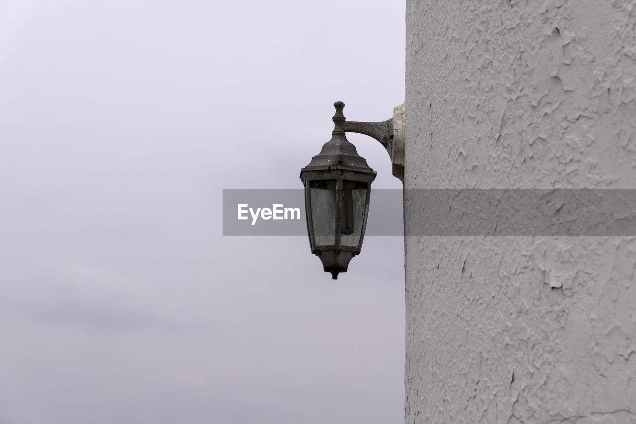 Low angle view of a lamp on wall