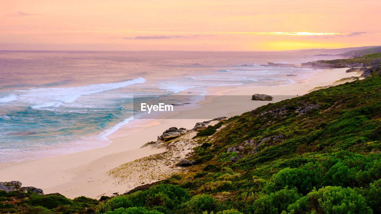 scenic view of sea at sunset