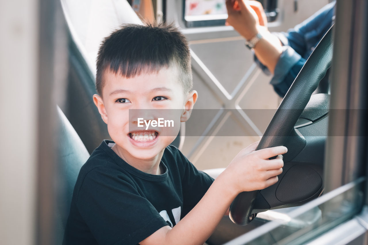 Portrait of boy in vehicle