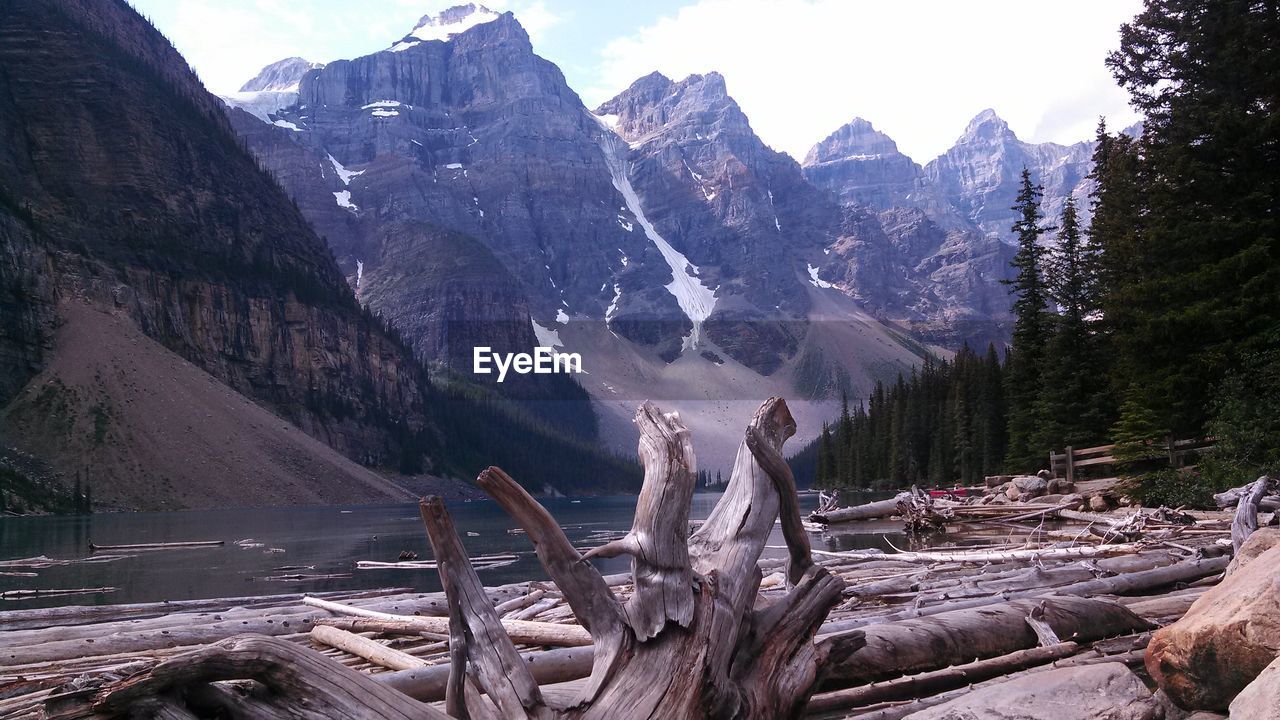 Scenic view of river by mountains