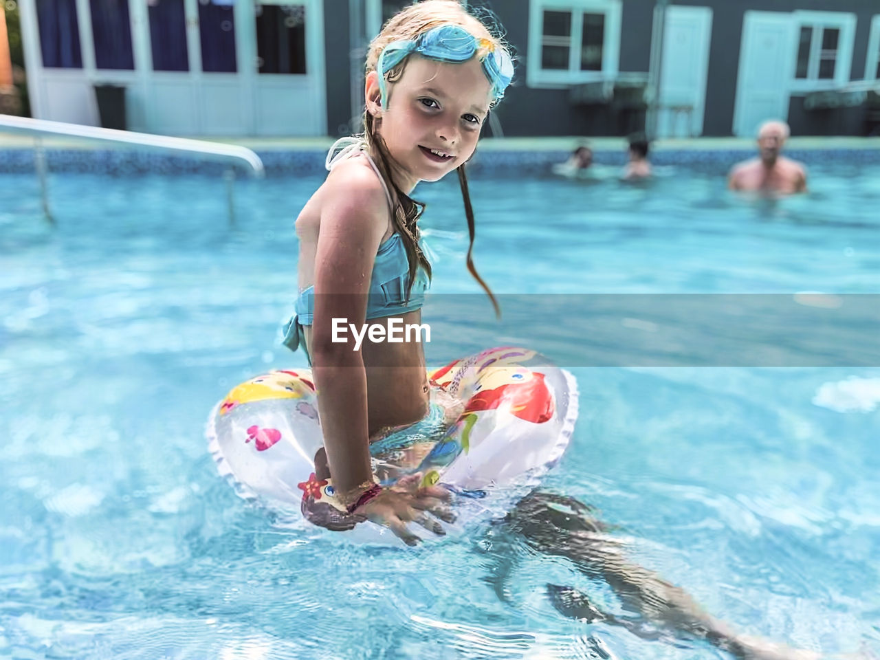 Full length of woman swimming in pool