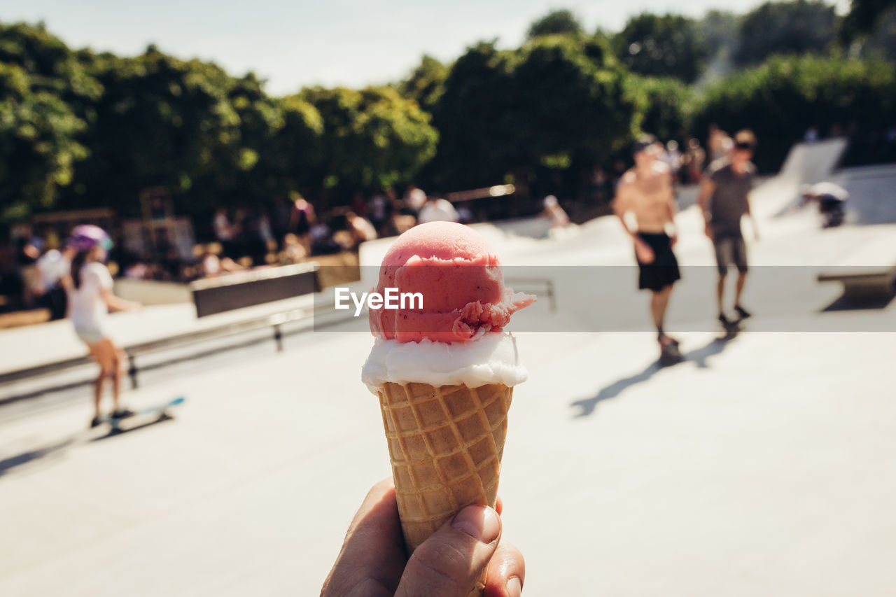 Cropped hand holding ice cream