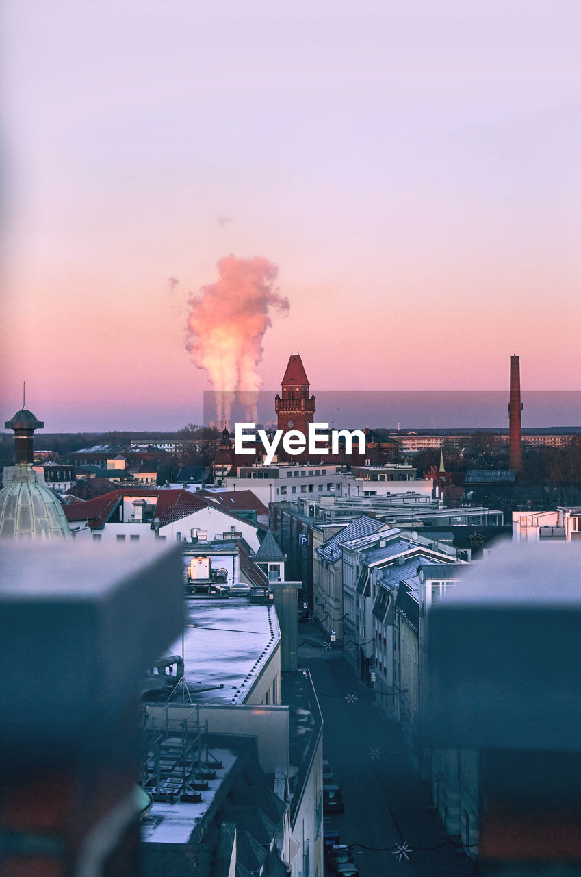 High angle view of cityscape against sky during sunset