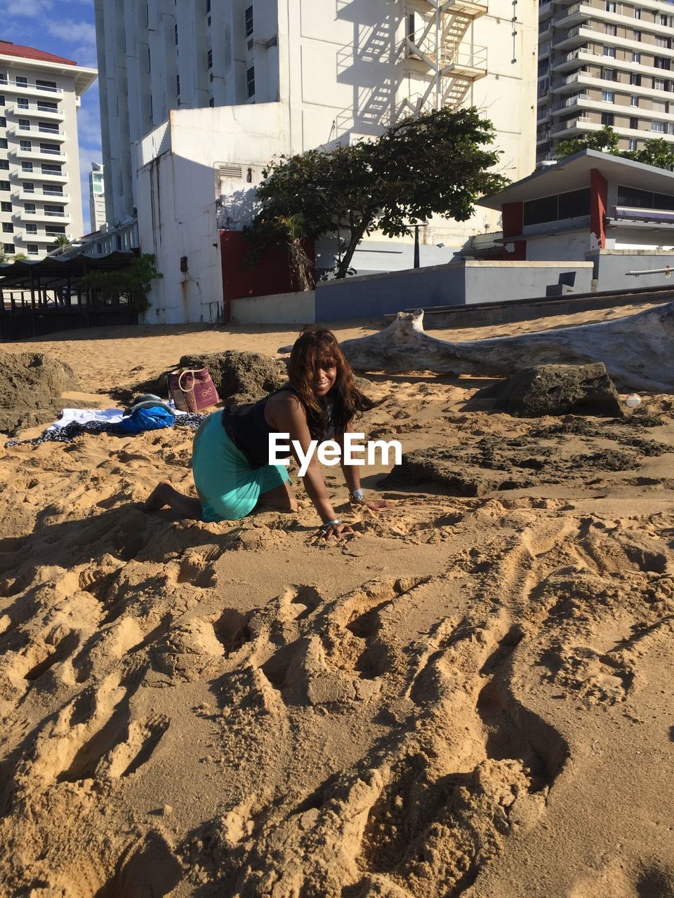 WOMEN SITTING ON BEACH