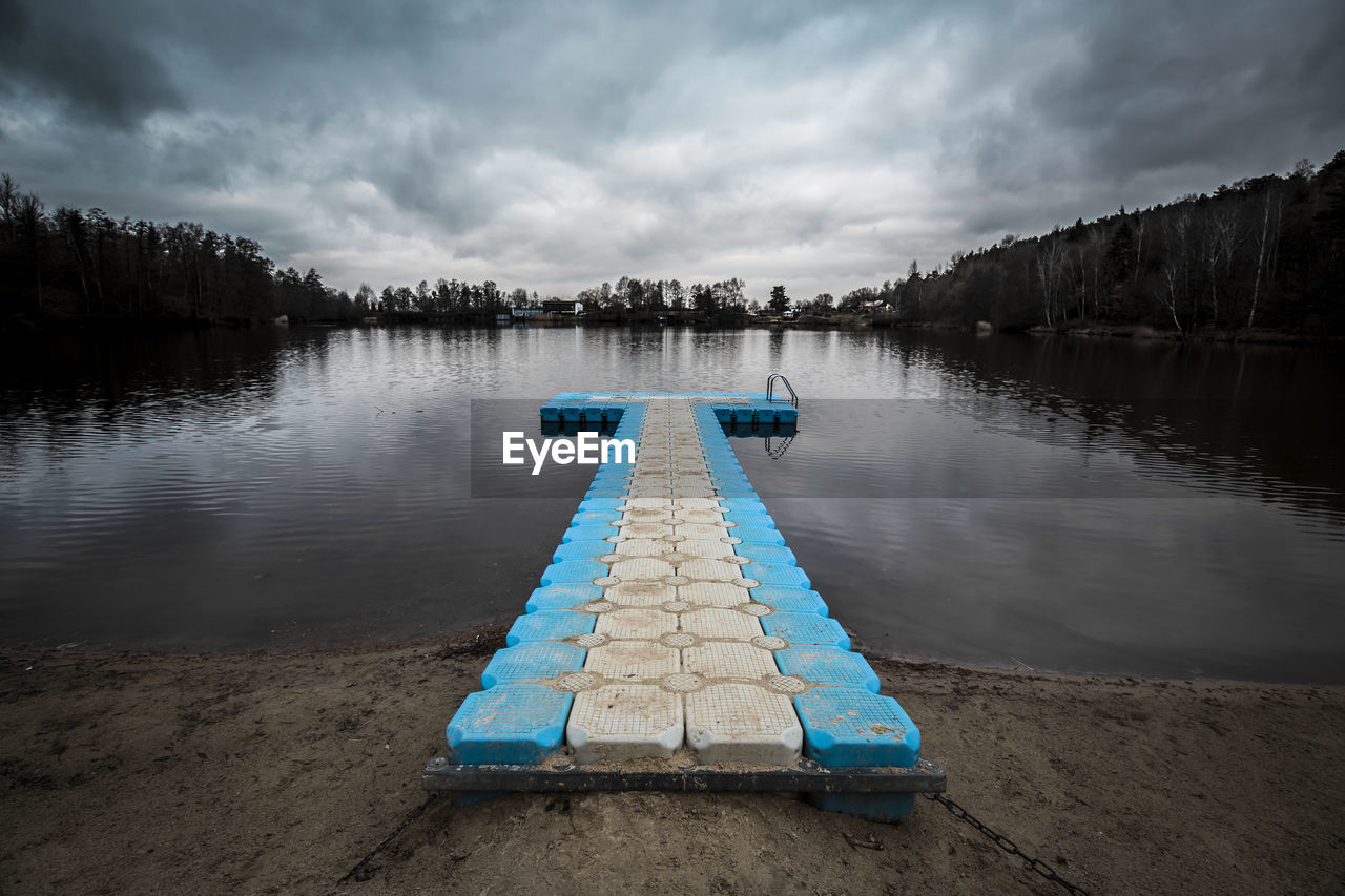 PIER AMIDST LAKE AGAINST SKY