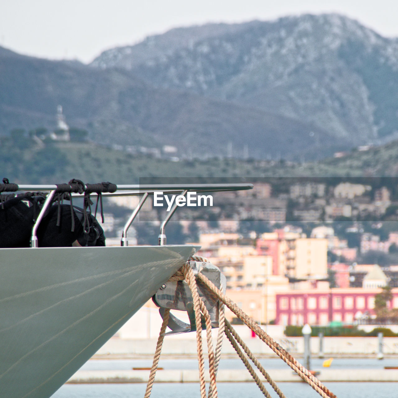 Cropped image of boat moored on lake