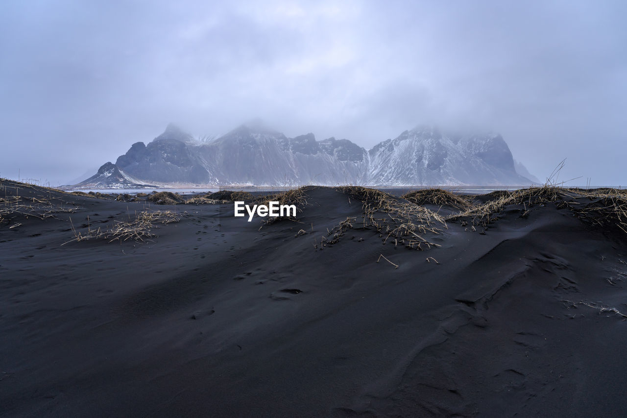 Amazing view of black sand stockness beach and vestrahorn mountain in background in iceland