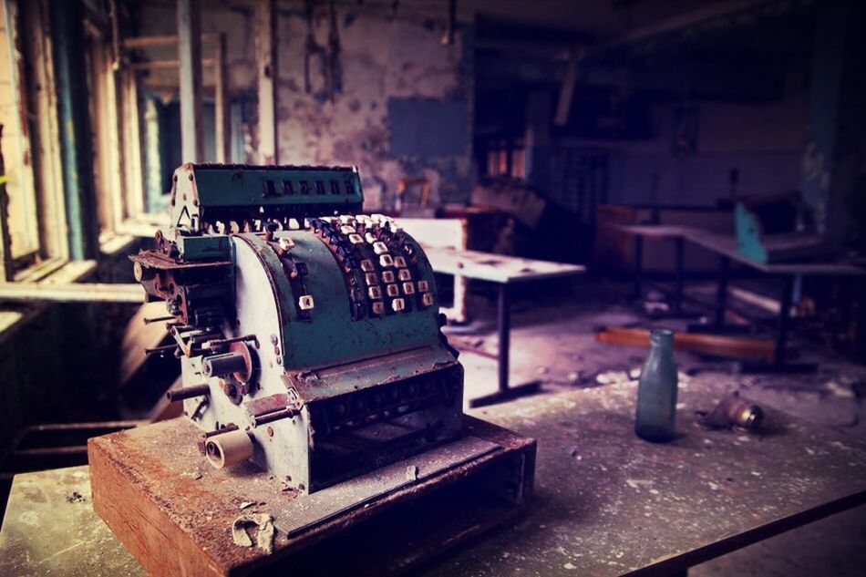 Old rusty cash register at damaged store