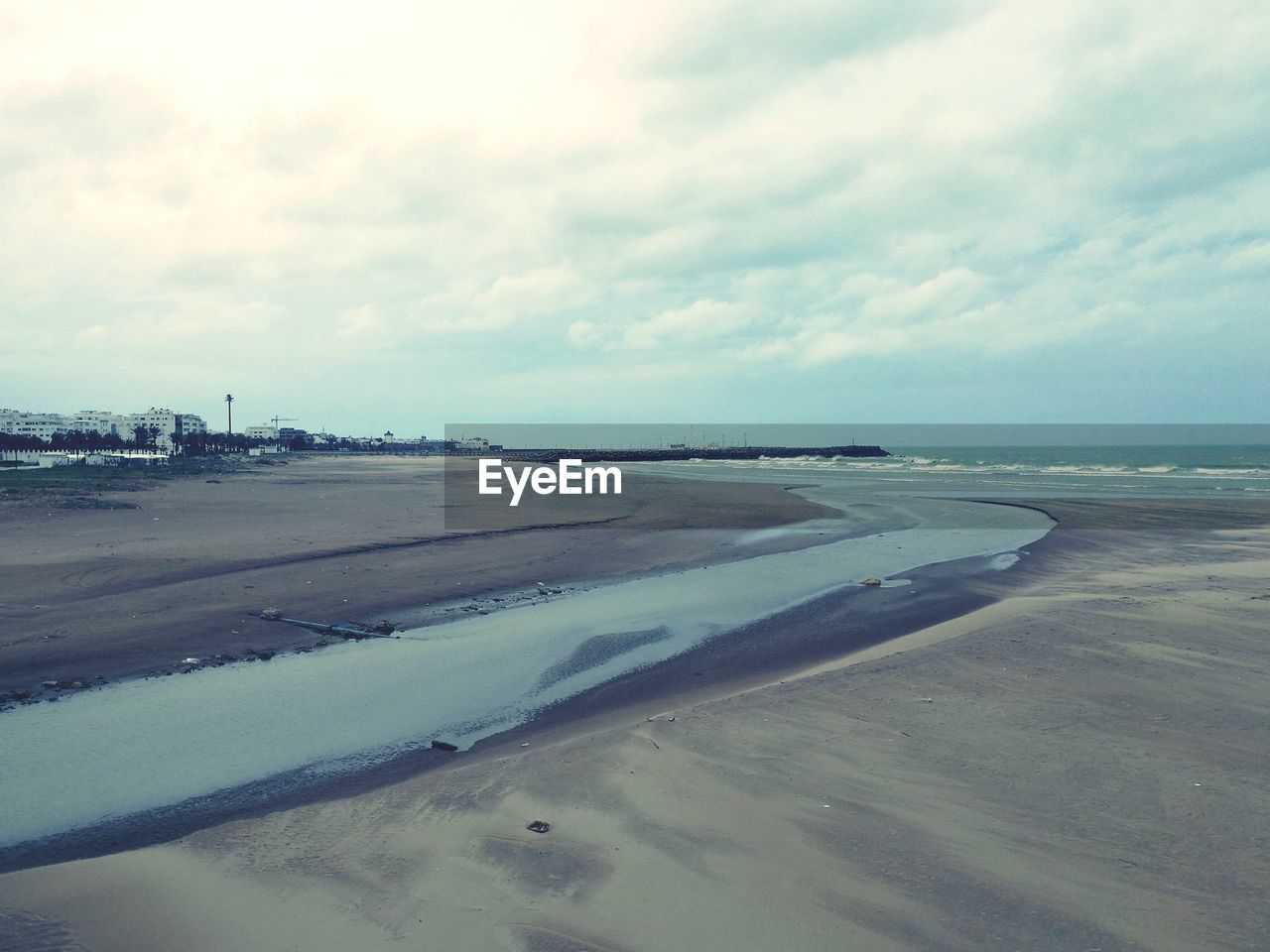 BEACH AGAINST SKY