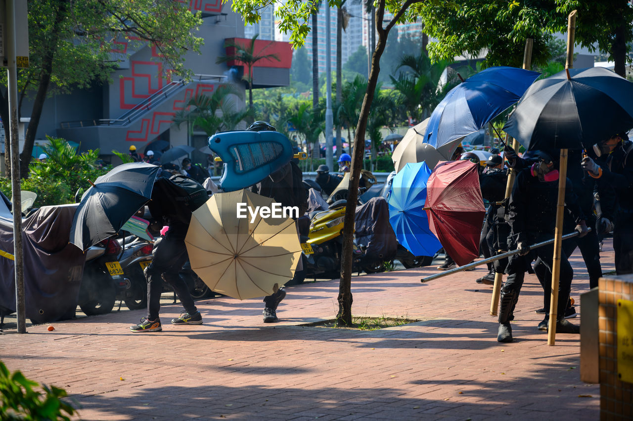 People on footpath in city