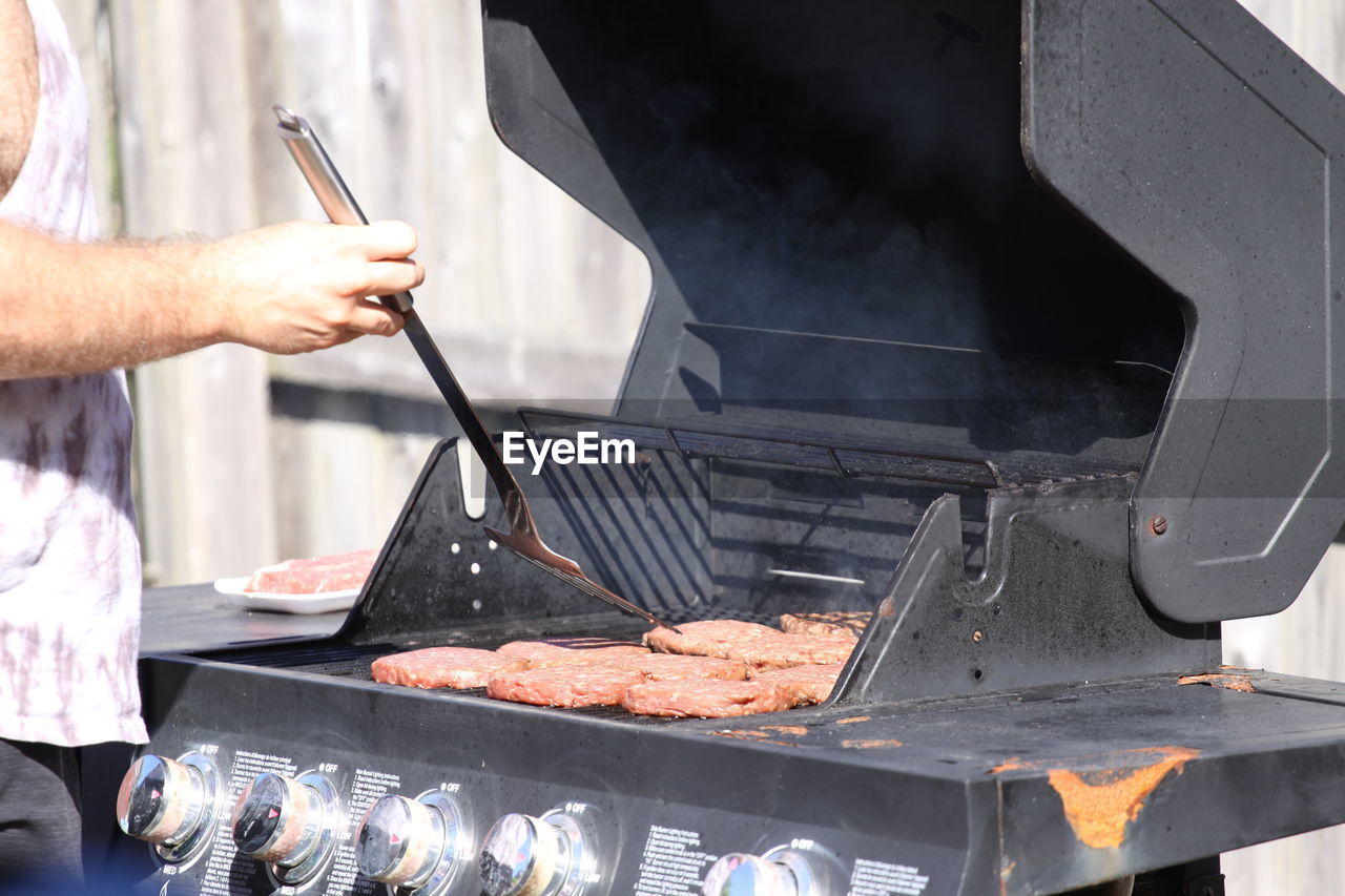 Midsection of man preparing food