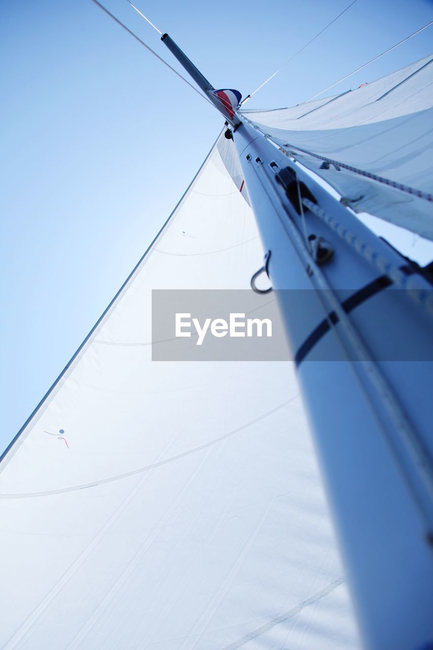 Low angle view of mast against sky