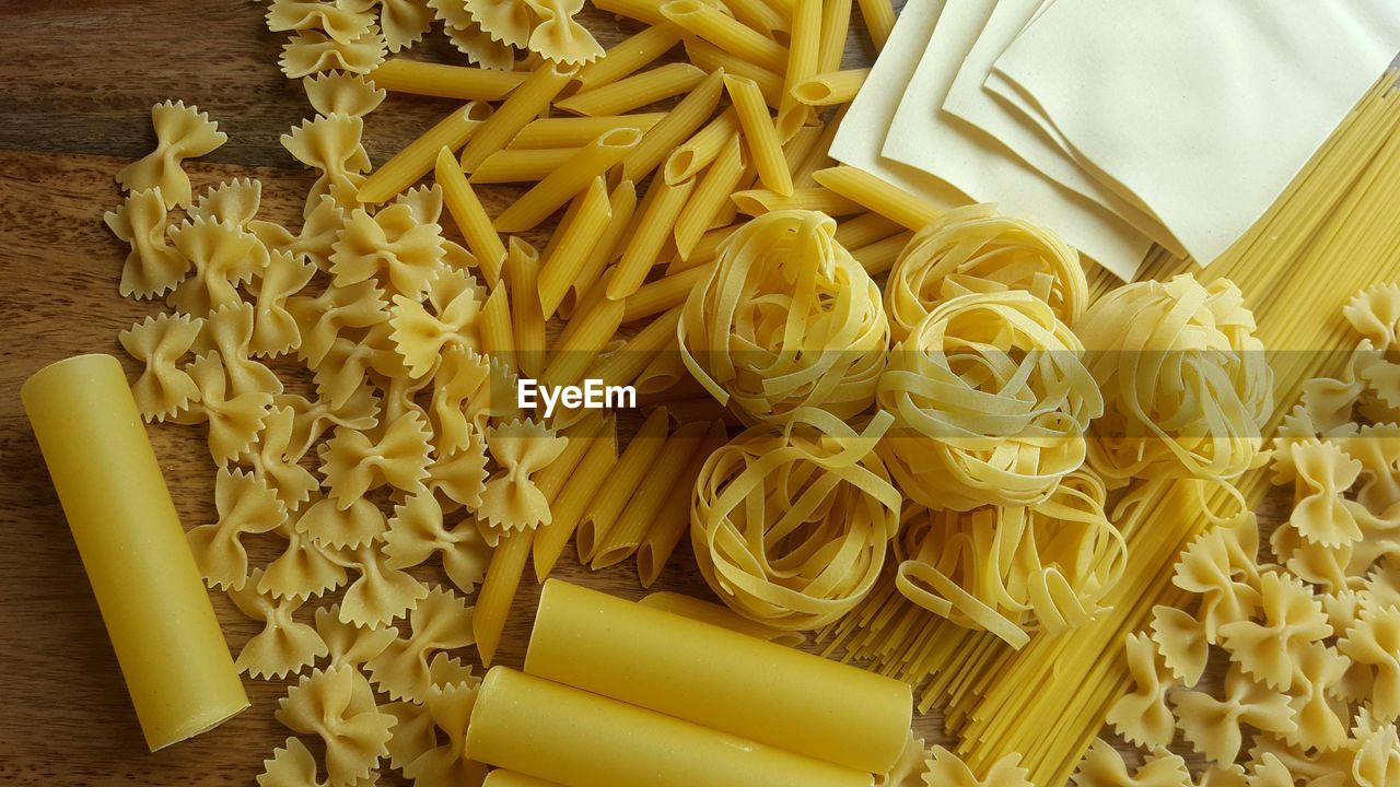 High angle view of various dried pasta