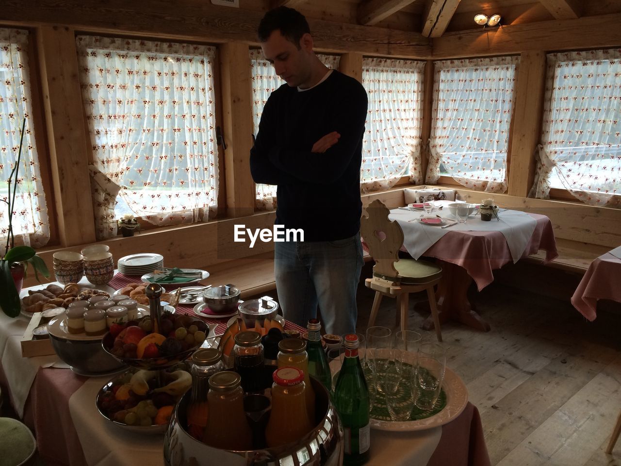 Man looking at food served on table at restaurant