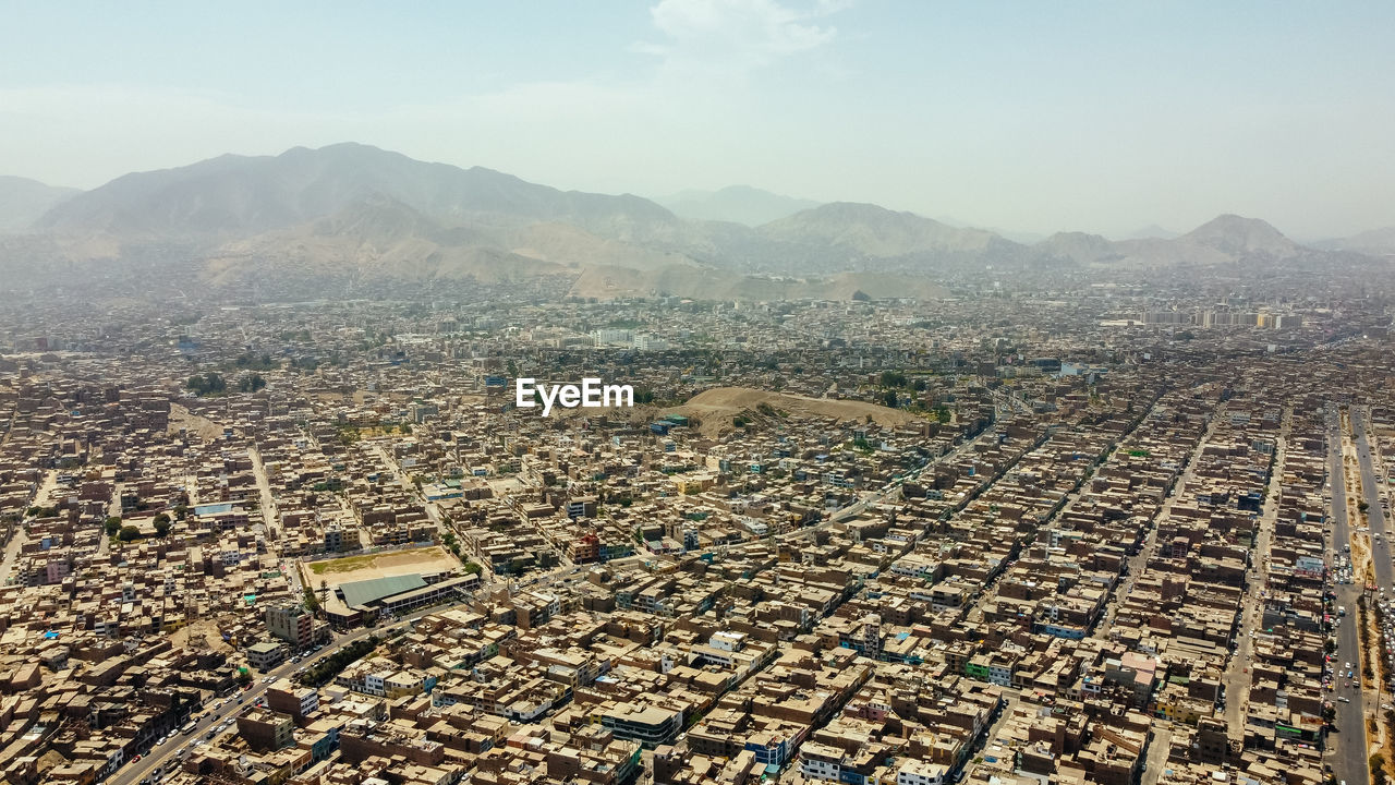 aerial view of townscape against sky