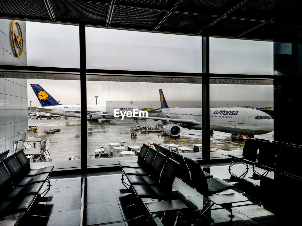 VIEW OF AIRPORT RUNWAY SEEN THROUGH WINDOW