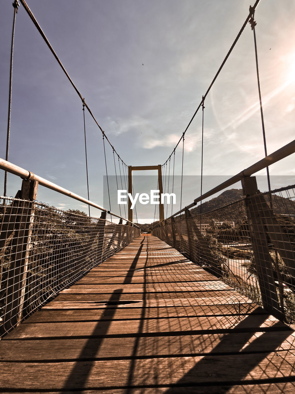 View of footbridge against sky