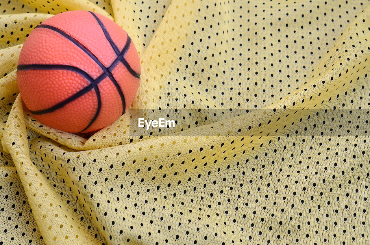 High angle view of basketball on fabric