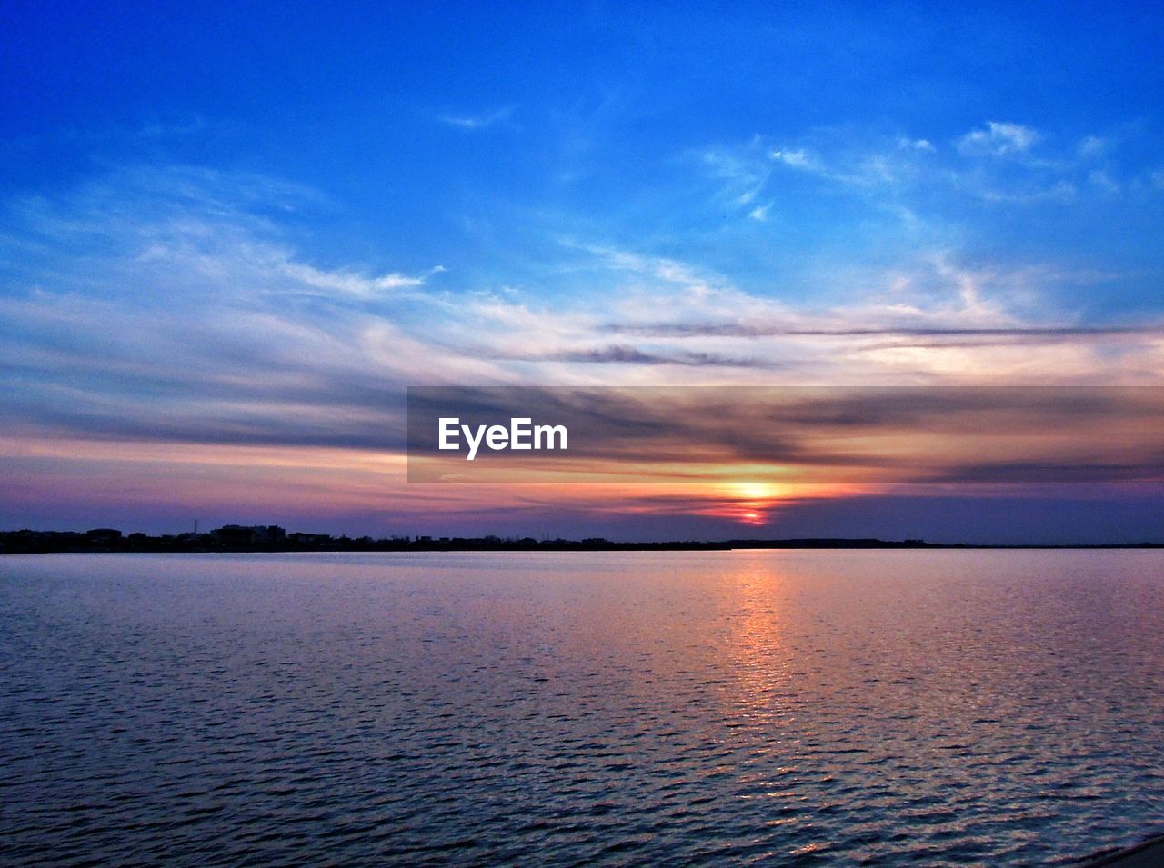 View of calm sea at sunset