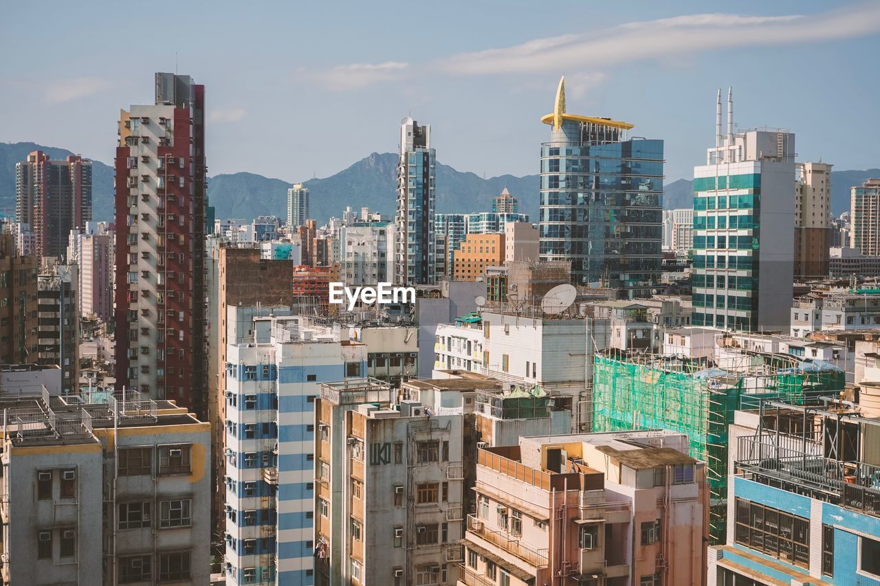 Buildings in city against sky