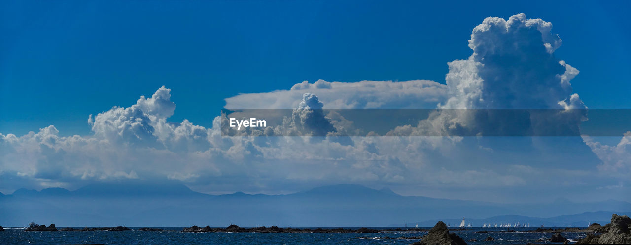 PANORAMIC SHOT OF SEA AGAINST CLOUDY SKY