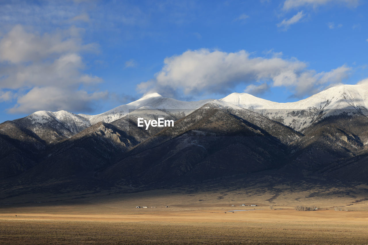 mountain, landscape, environment, scenics - nature, snow, mountain range, sky, cold temperature, winter, beauty in nature, cloud, snowcapped mountain, land, nature, plateau, travel destinations, travel, no people, wilderness, tranquility, natural environment, tranquil scene, outdoors, day, tourism, water, valley, non-urban scene, desert, lake, mountain peak