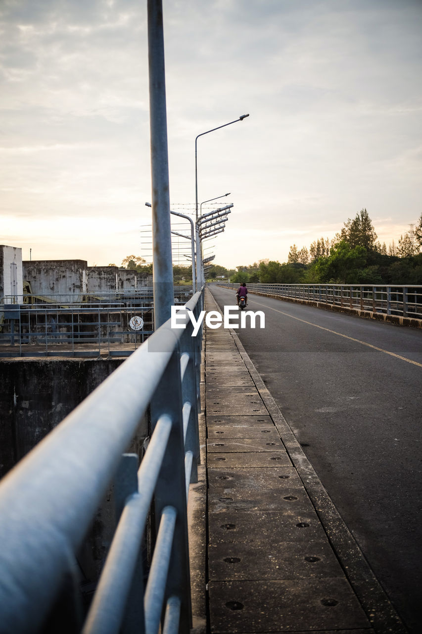 SURFACE LEVEL OF BRIDGE AGAINST SKY