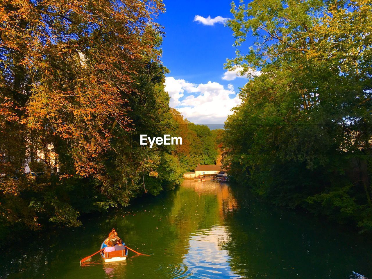 RIVER AMIDST TREES AGAINST SKY DURING AUTUMN