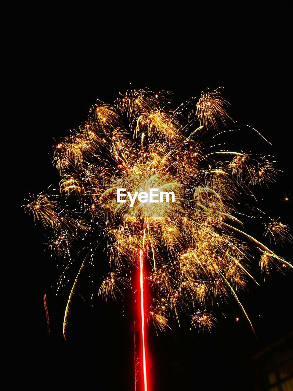 LOW ANGLE VIEW OF ILLUMINATED FIREWORKS