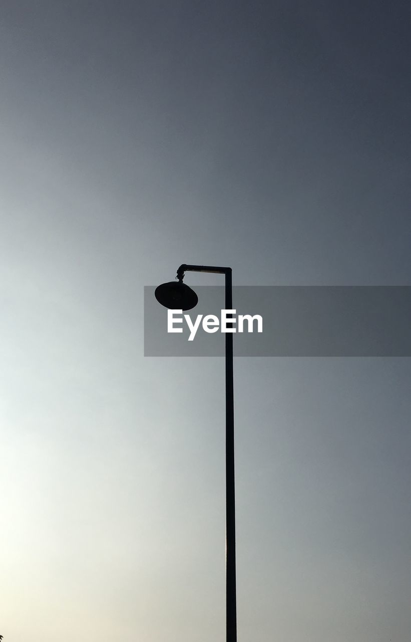 LOW ANGLE VIEW OF STREET LIGHTS AGAINST SKY
