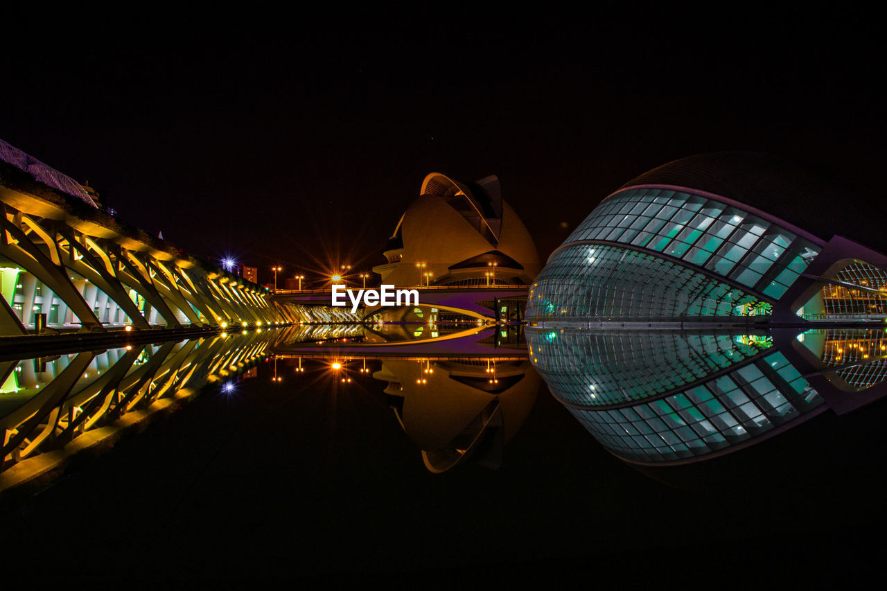 REFLECTION OF ILLUMINATED BUILDINGS IN WATER