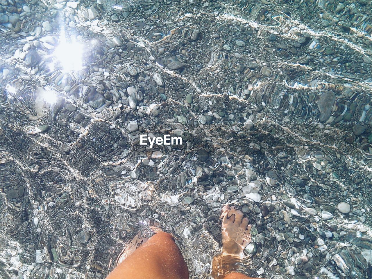 High angle view of woman walking in lake