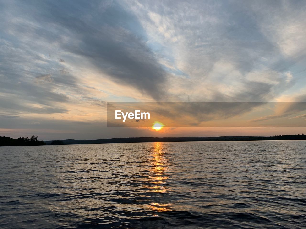 SCENIC VIEW OF SEA AGAINST ORANGE SKY