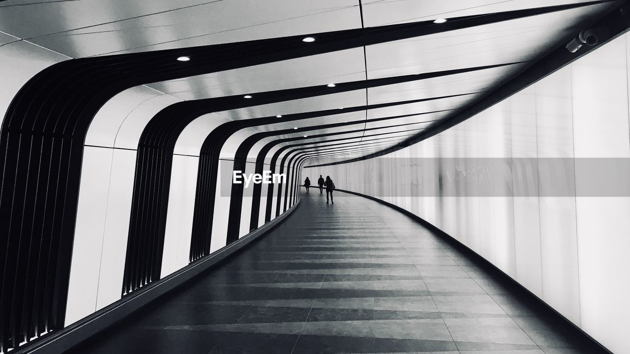 People walking in tunnel