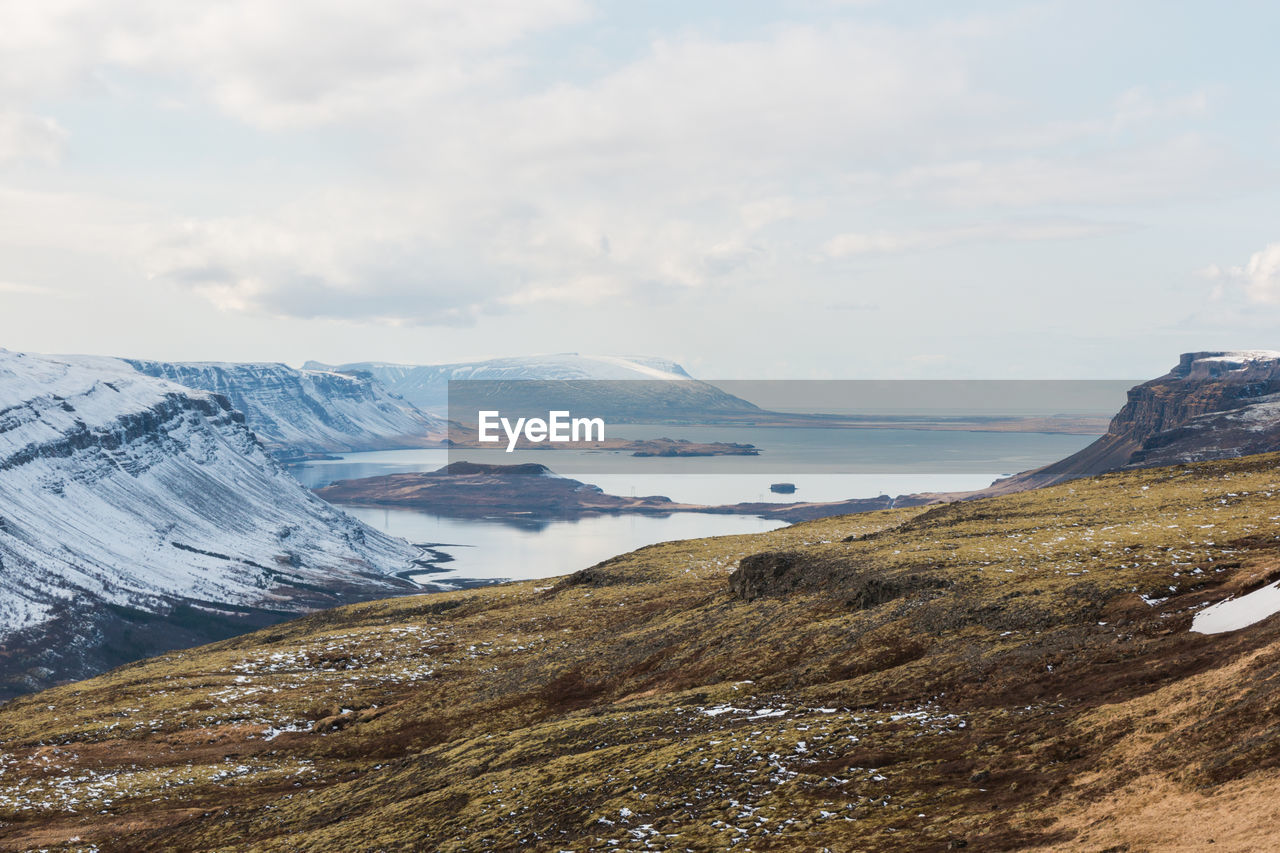 Scenic view of snowcapped mountains against sky