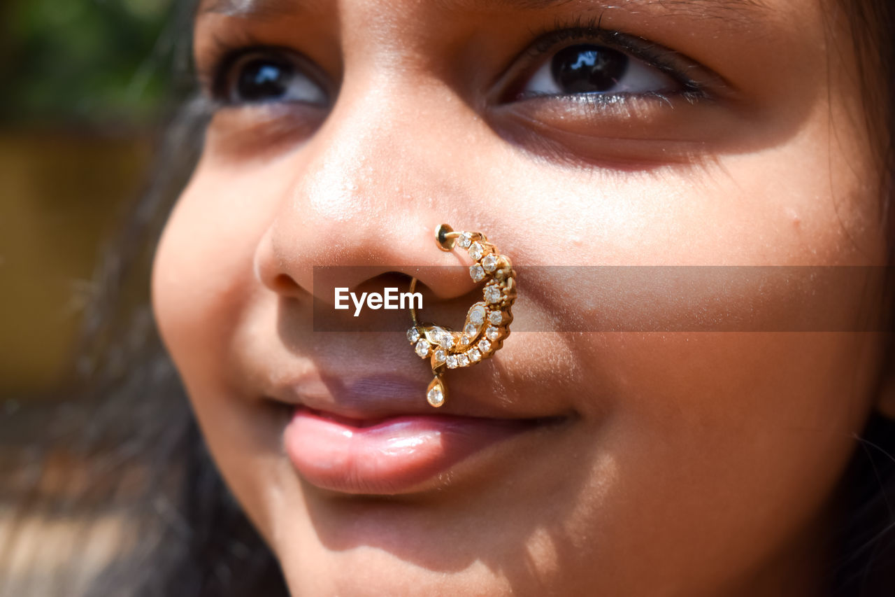 Close-up portrait of girl wearing nose ring