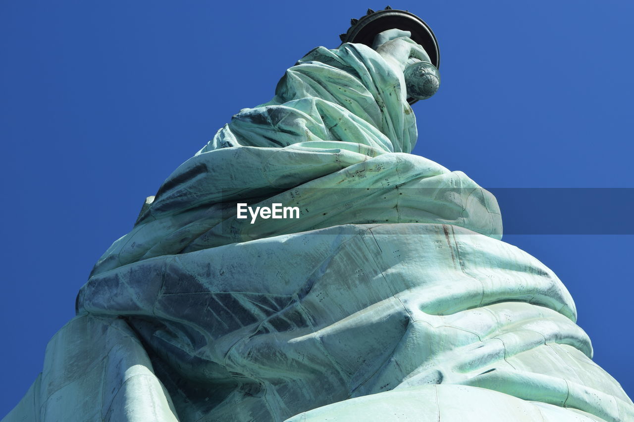 Low angle view of built structure against clear blue sky