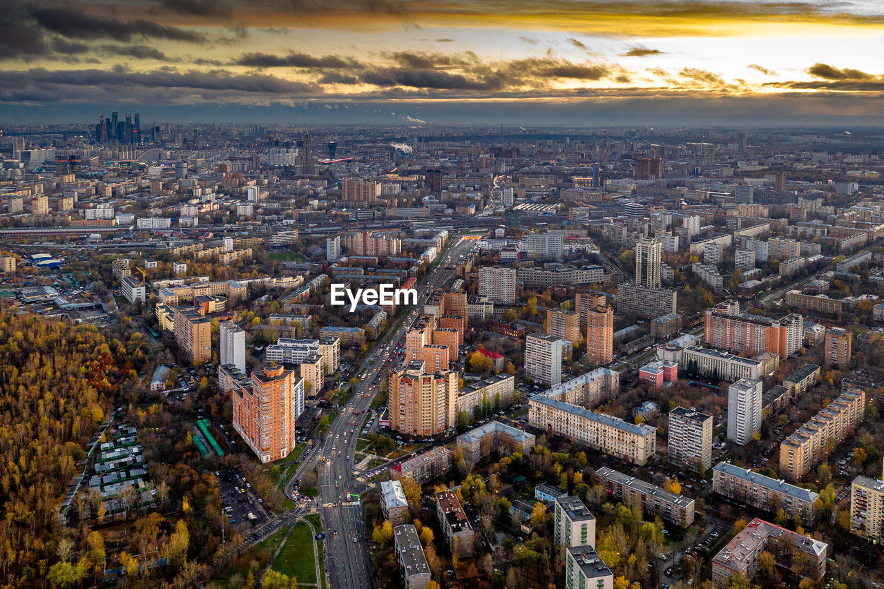 High angle view of city buildings during sunset