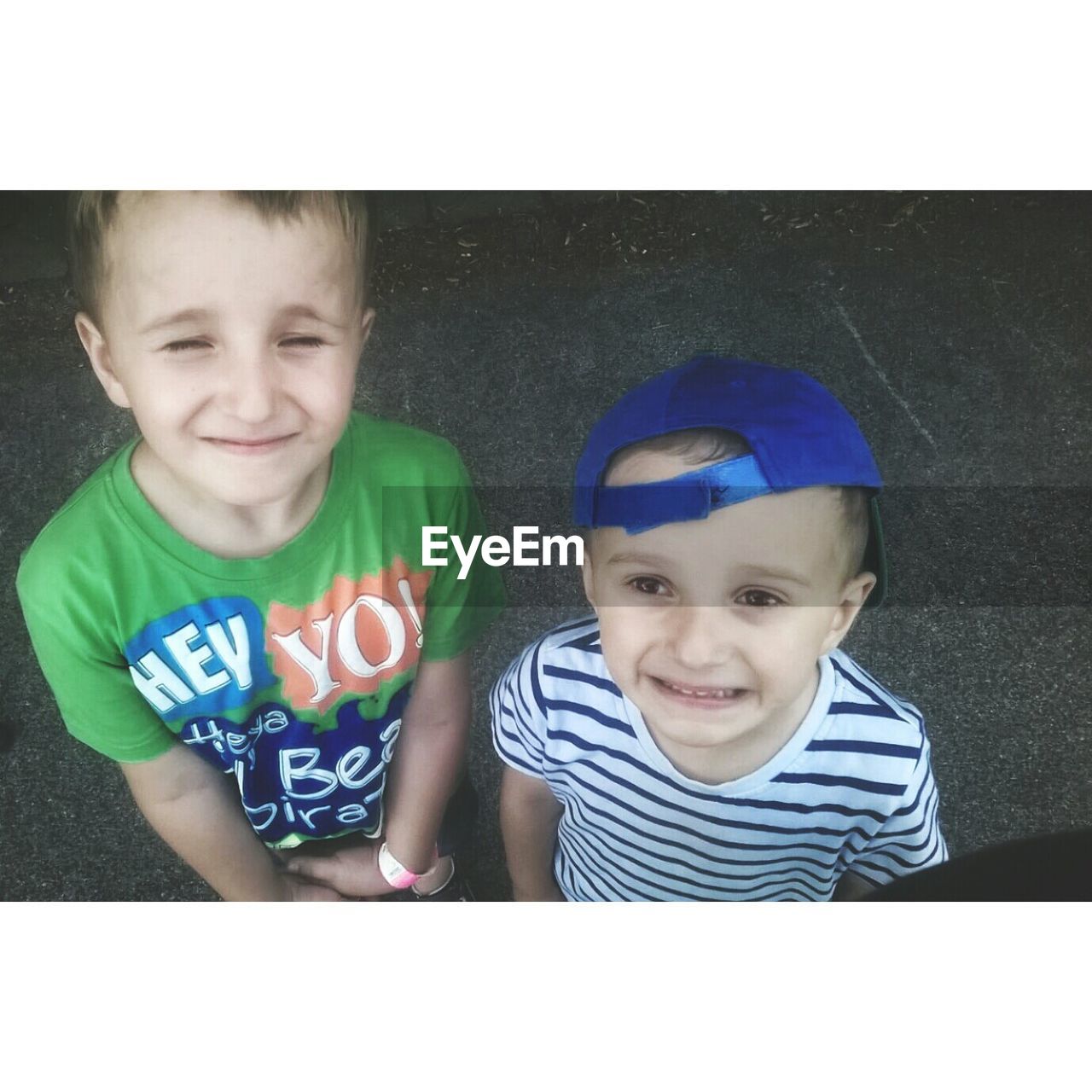 High angle view of siblings standing on street