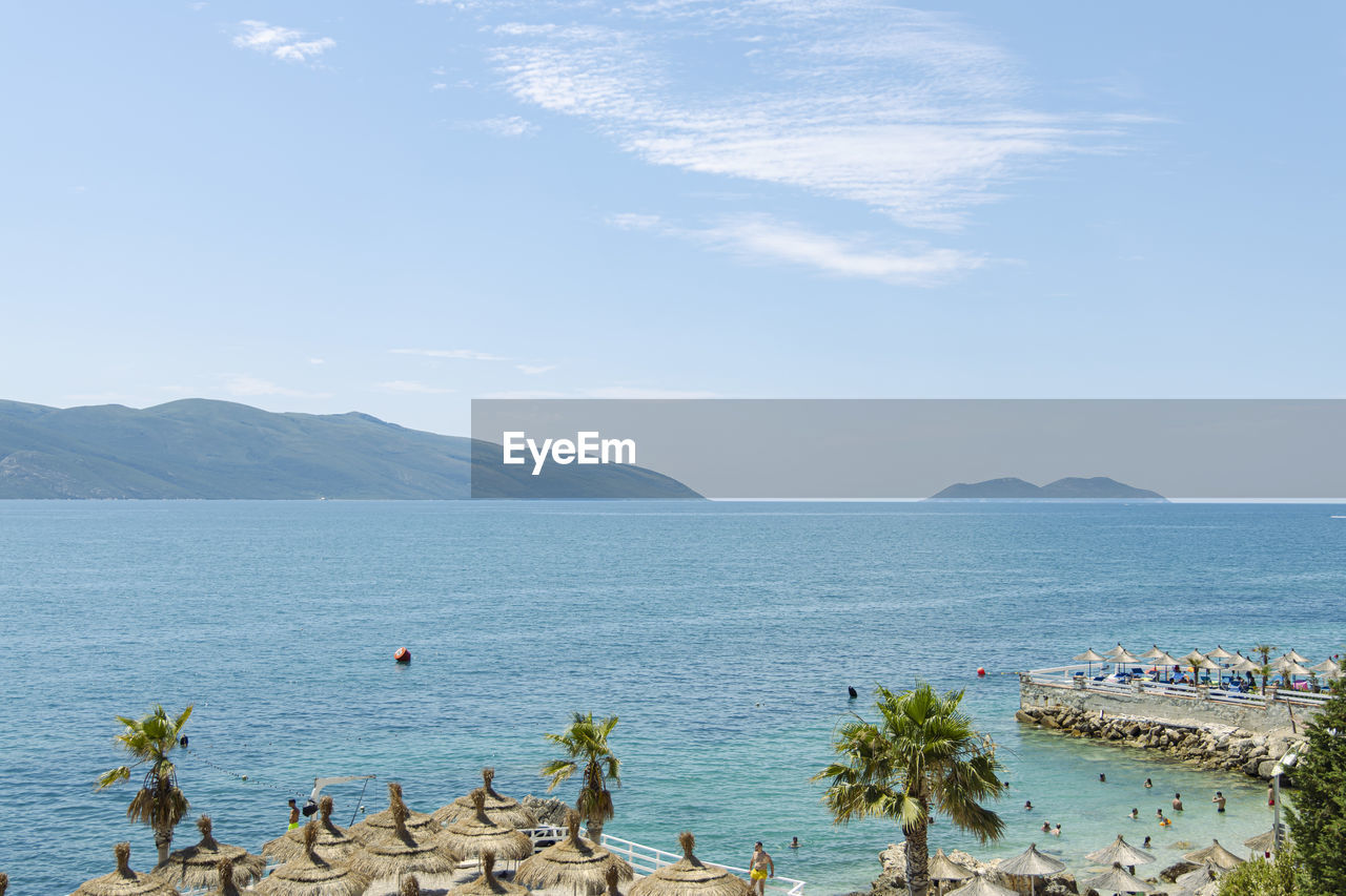 SCENIC VIEW OF SEA AND MOUNTAINS AGAINST SKY