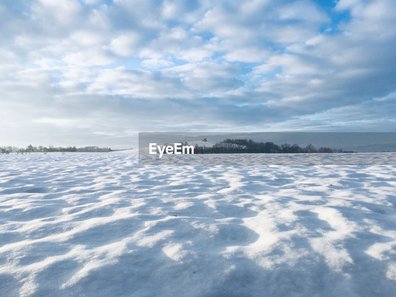 SNOW ON LAND AGAINST SKY DURING WINTER