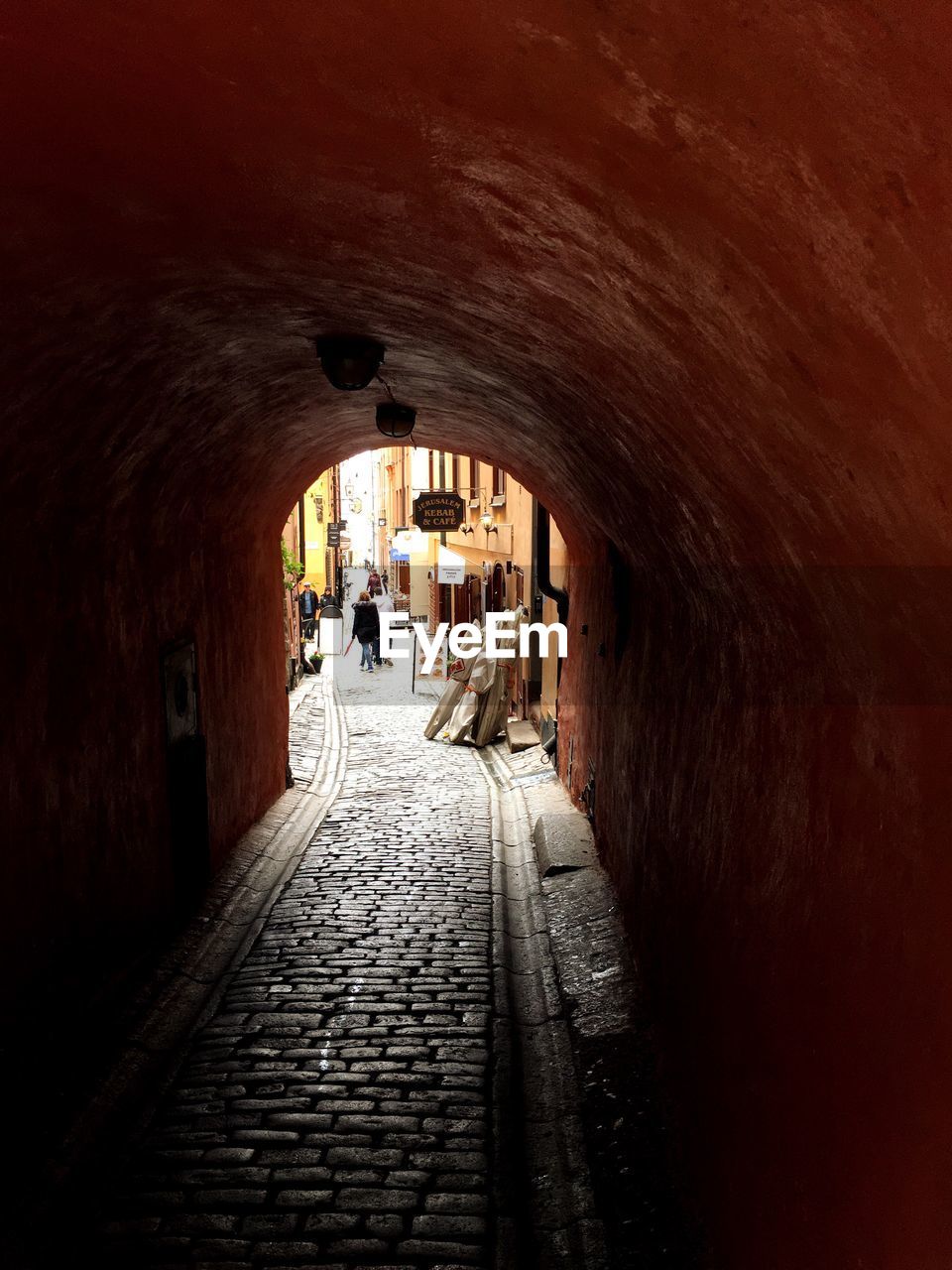 Woman walking in tunnel